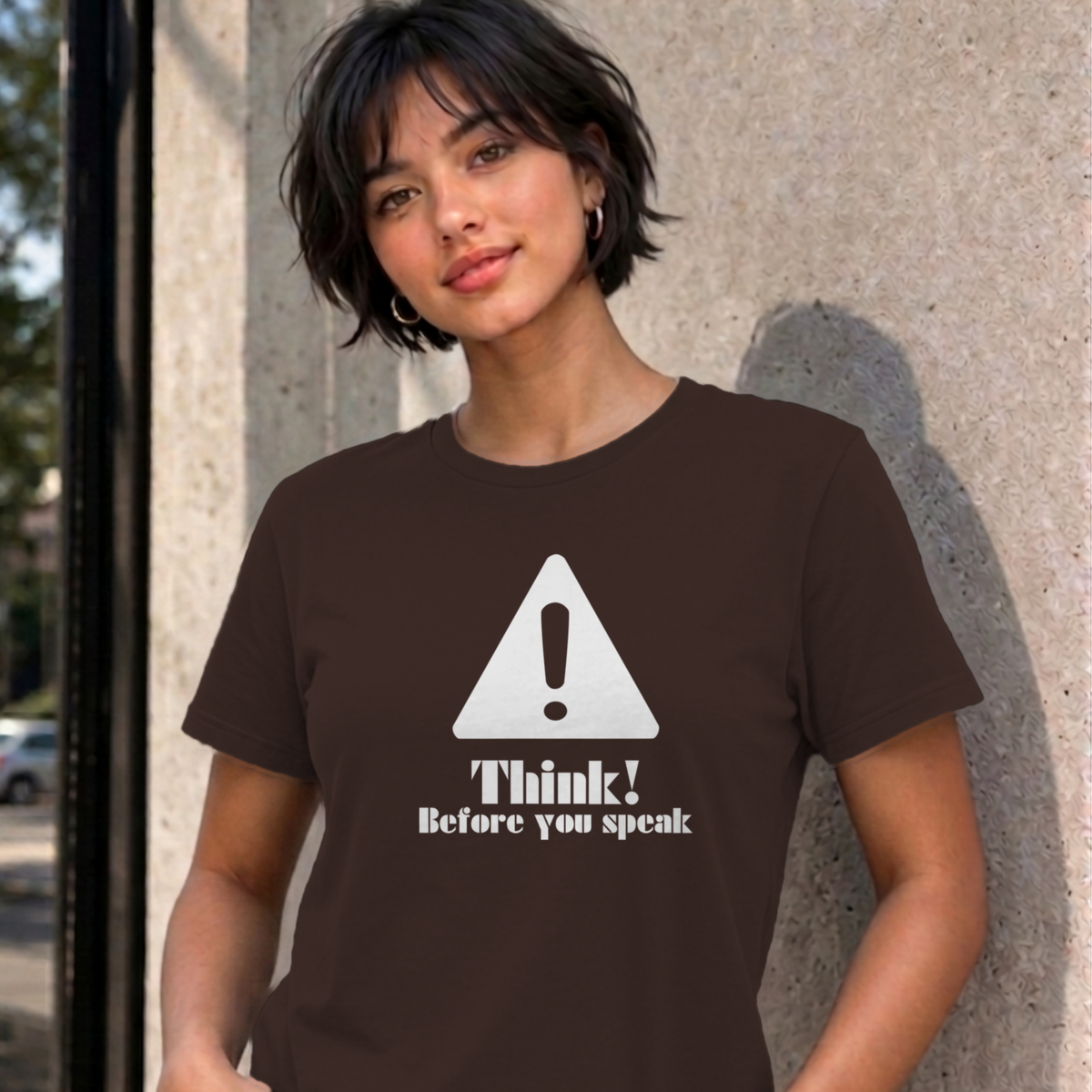 Woman wearing the dark chocolate Think Before You Speak graphic tee
