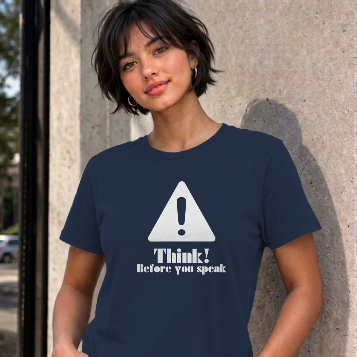 Woman wearing the navy Think Before You Speak graphic tee