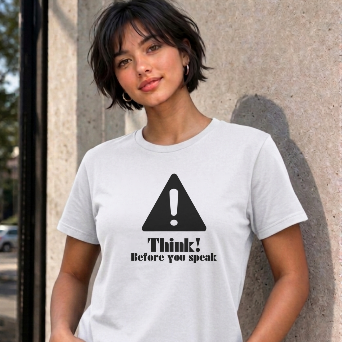 Woman wearing the white Think Before You Speak graphic tee