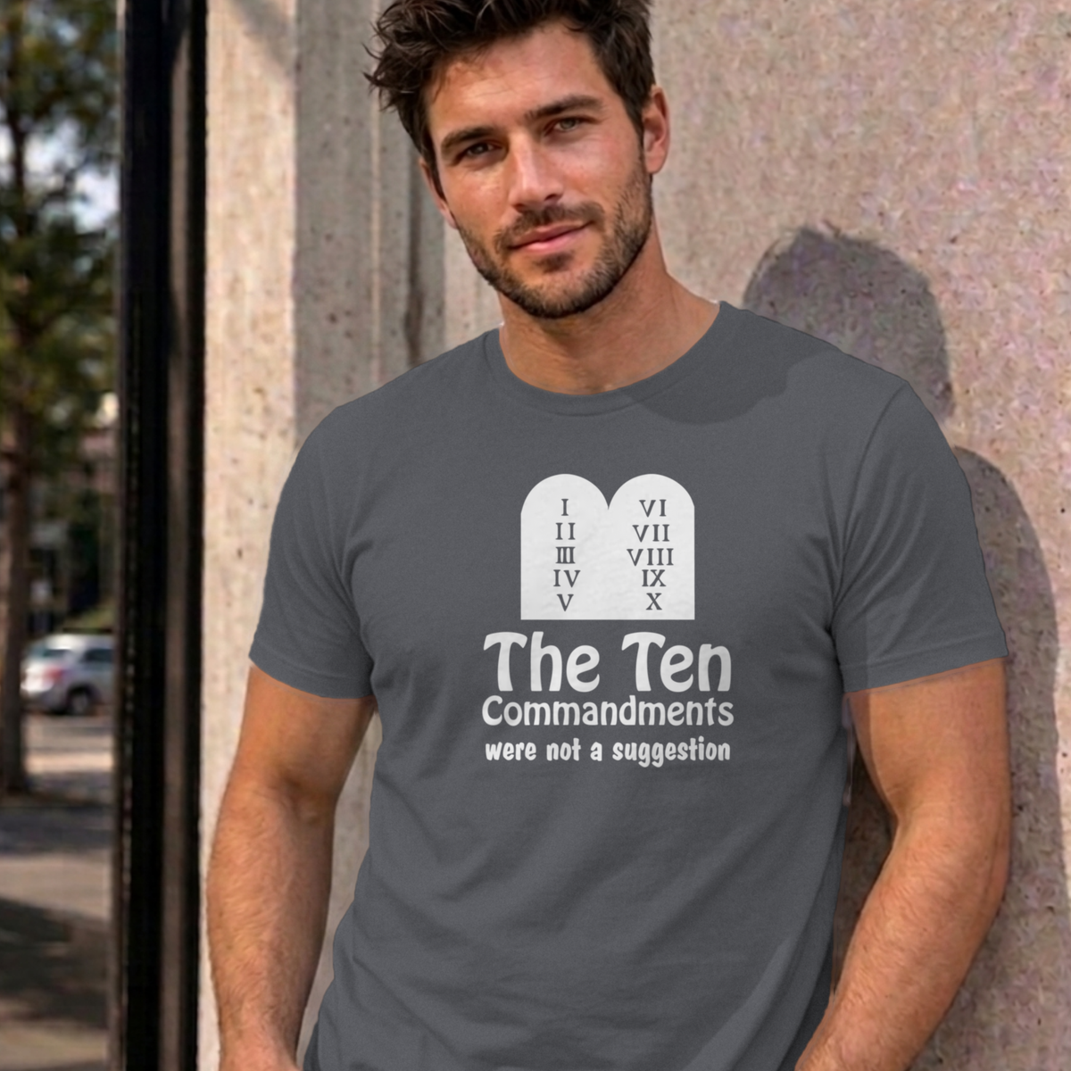 Man wearing the charcoal Ten Commandments graphic tee