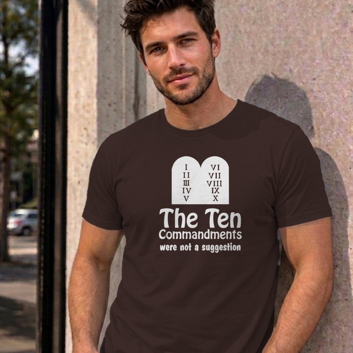 Man wearing the dark chocolate Ten Commandments graphic tee
