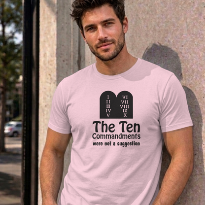 Man wearing the light pink Ten Commandments graphic tee