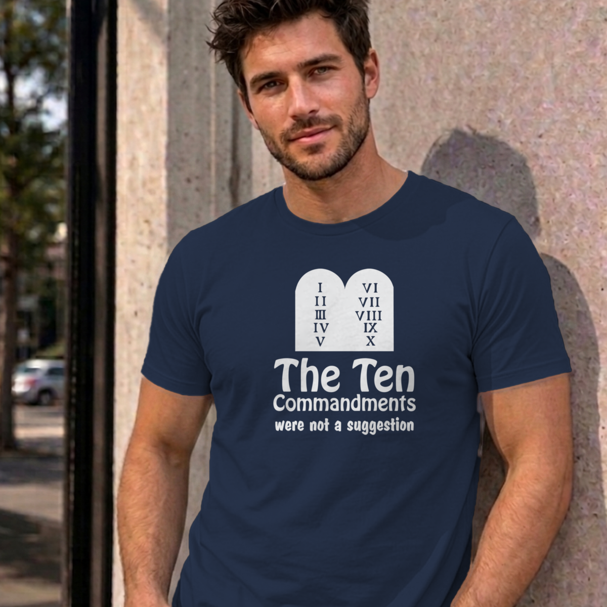 Man wearing the navy Ten Commandments graphic tee