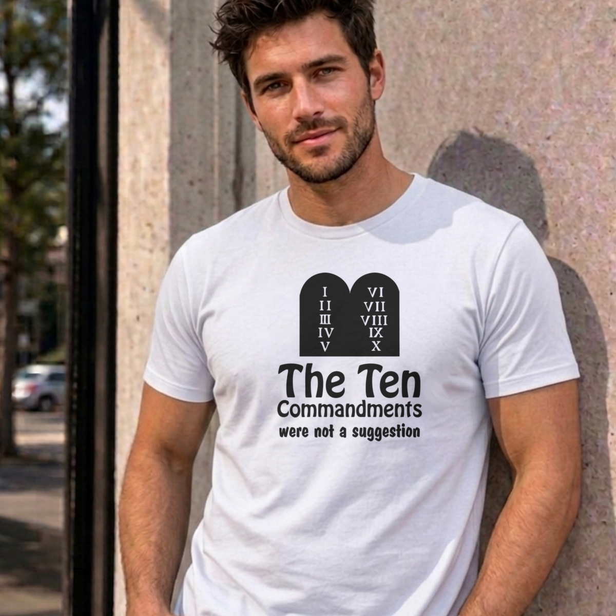 Man wearing the white Ten Commandments graphic tee