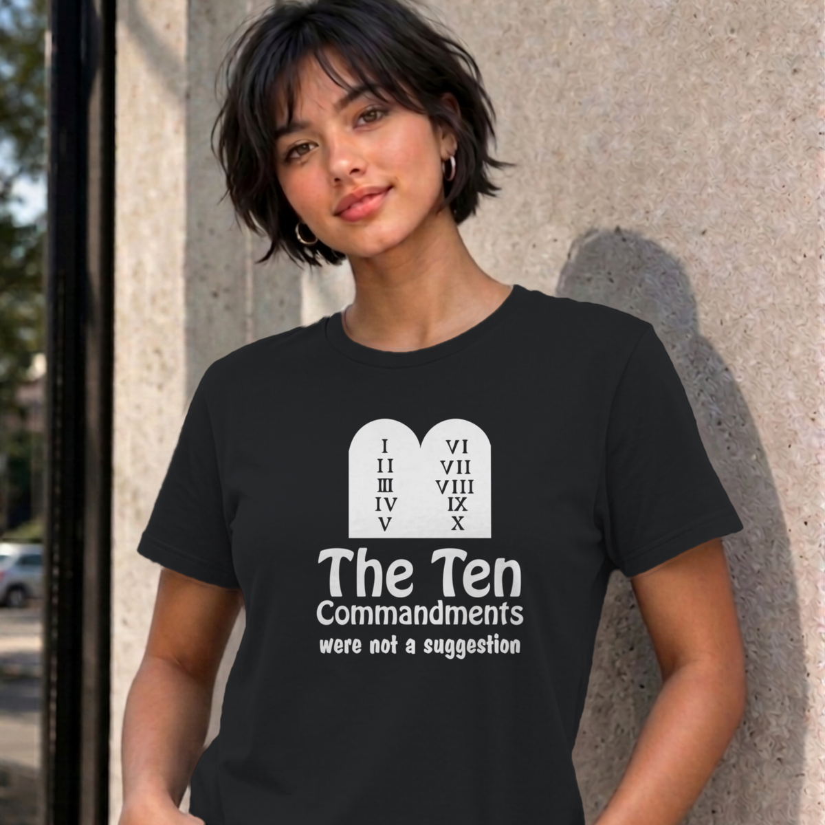 Woman wearing the black Ten Commandments graphic tee