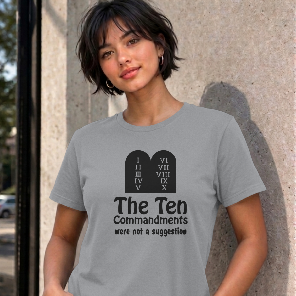 Woman wearing the sport grey Ten Commandments graphic tee