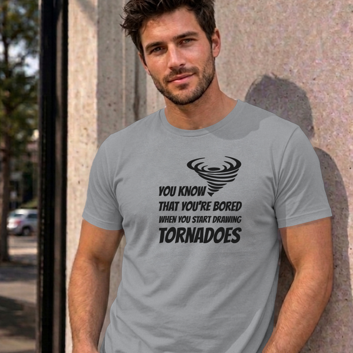 Man wearing the sport grey Drawing Tornadoes graphic tee