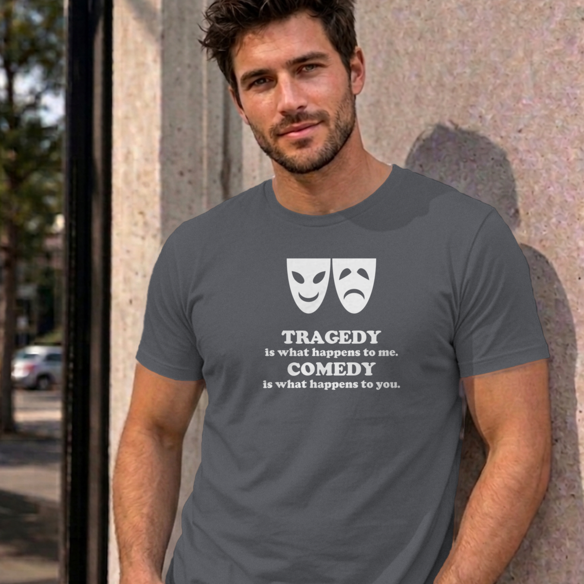 Man wearing the charcoal Tragedy and Comedy graphic tee