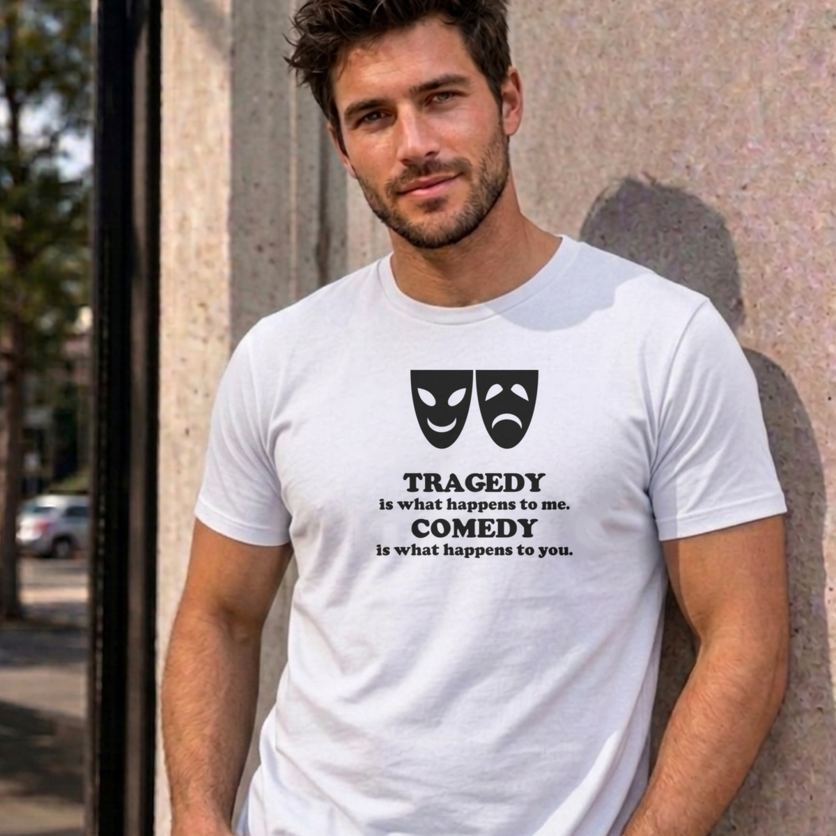 Man wearing the white Tragedy and Comedy graphic tee