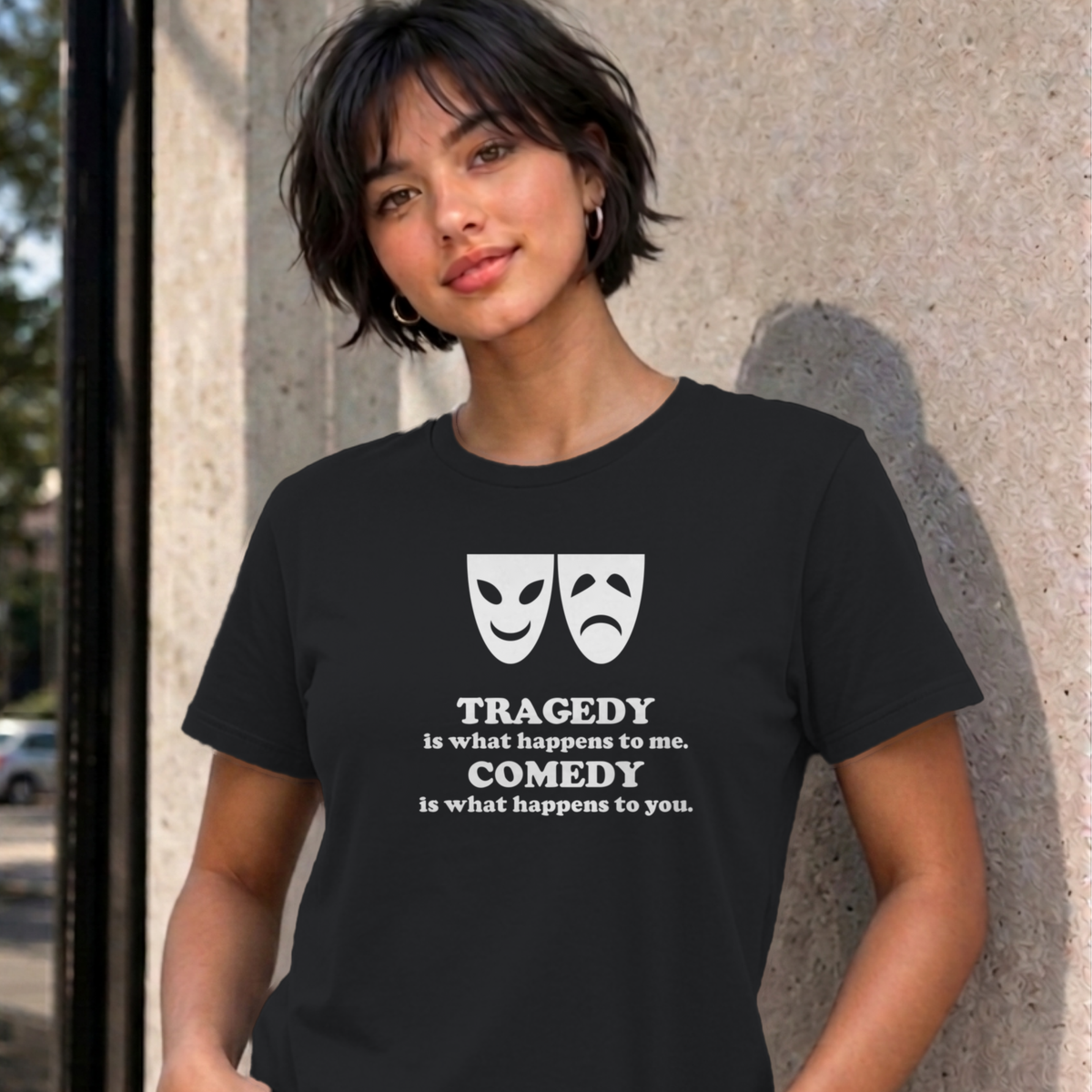 Woman wearing the black Tragedy and Comedy graphic tee