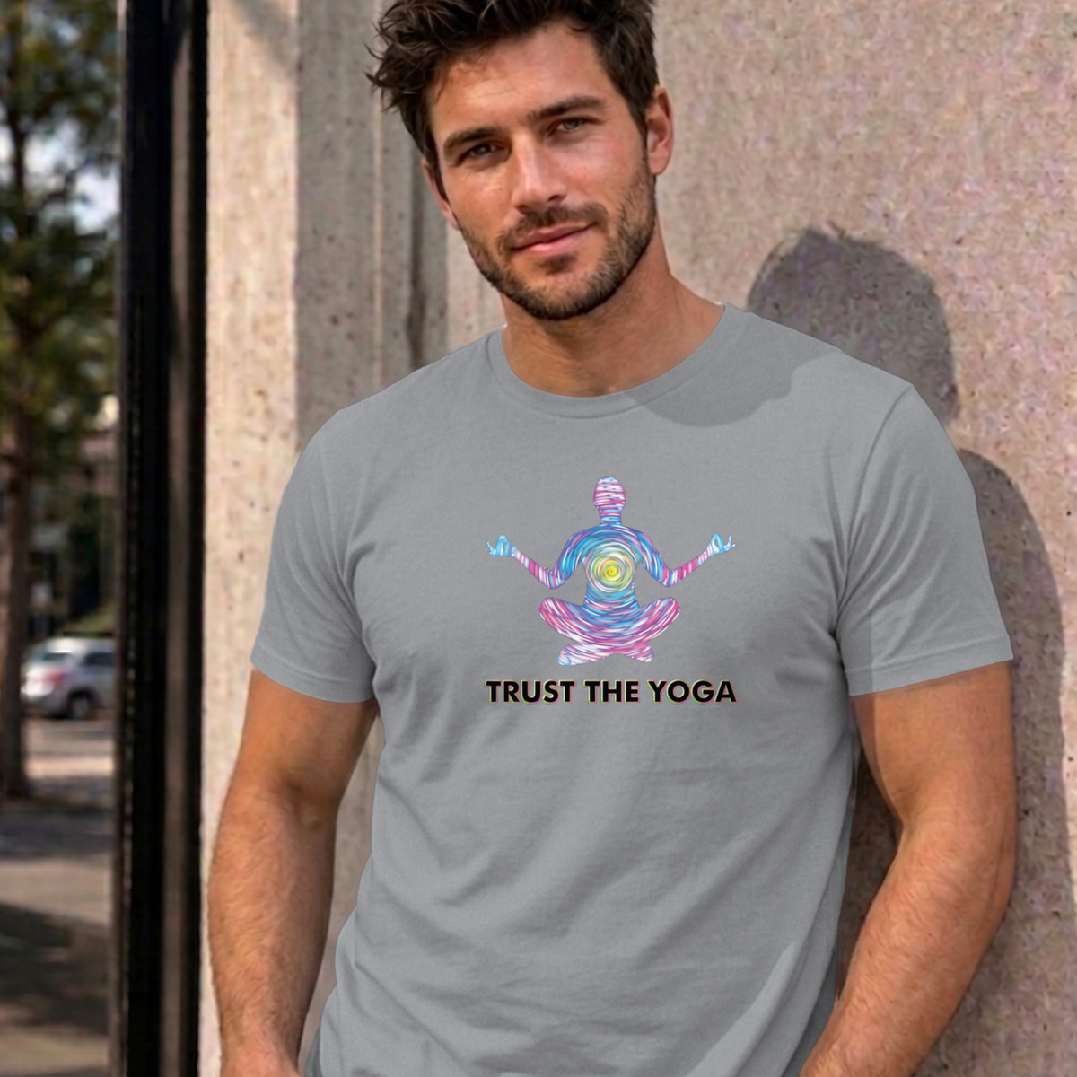 Man wearing the sport grey Trust the Yoga graphic tee