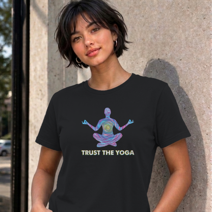 Woman wearing the black Trust the Yoga graphic tee