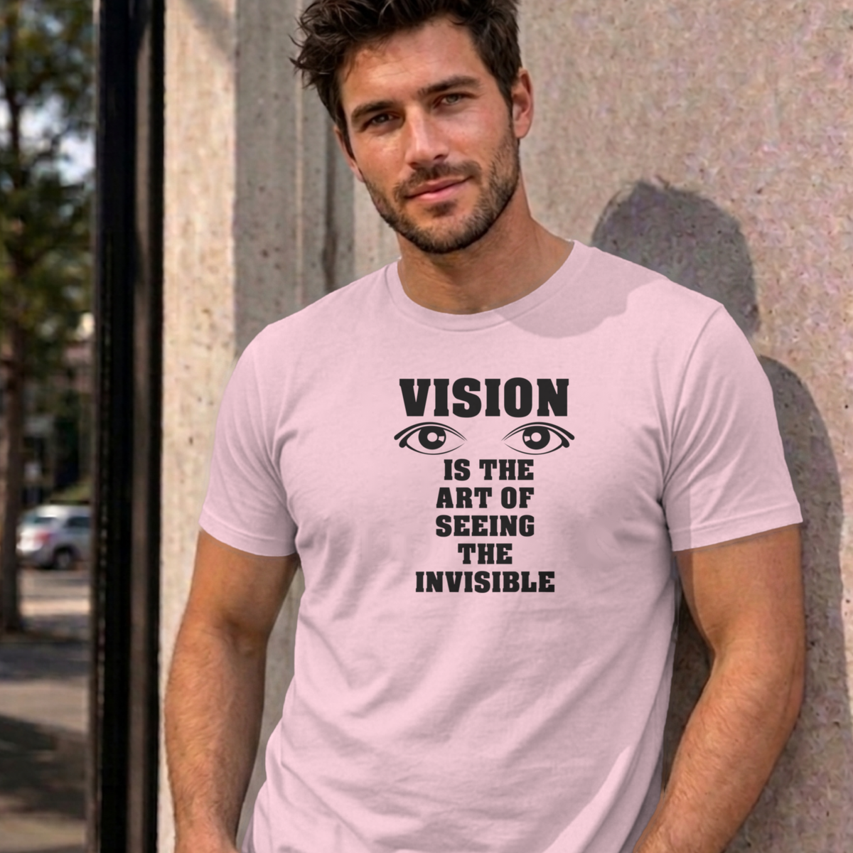 Man wearing the light pink Vision graphic tee