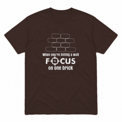 Focus on One Brick graphic tee in dark chocolate with white print, front view