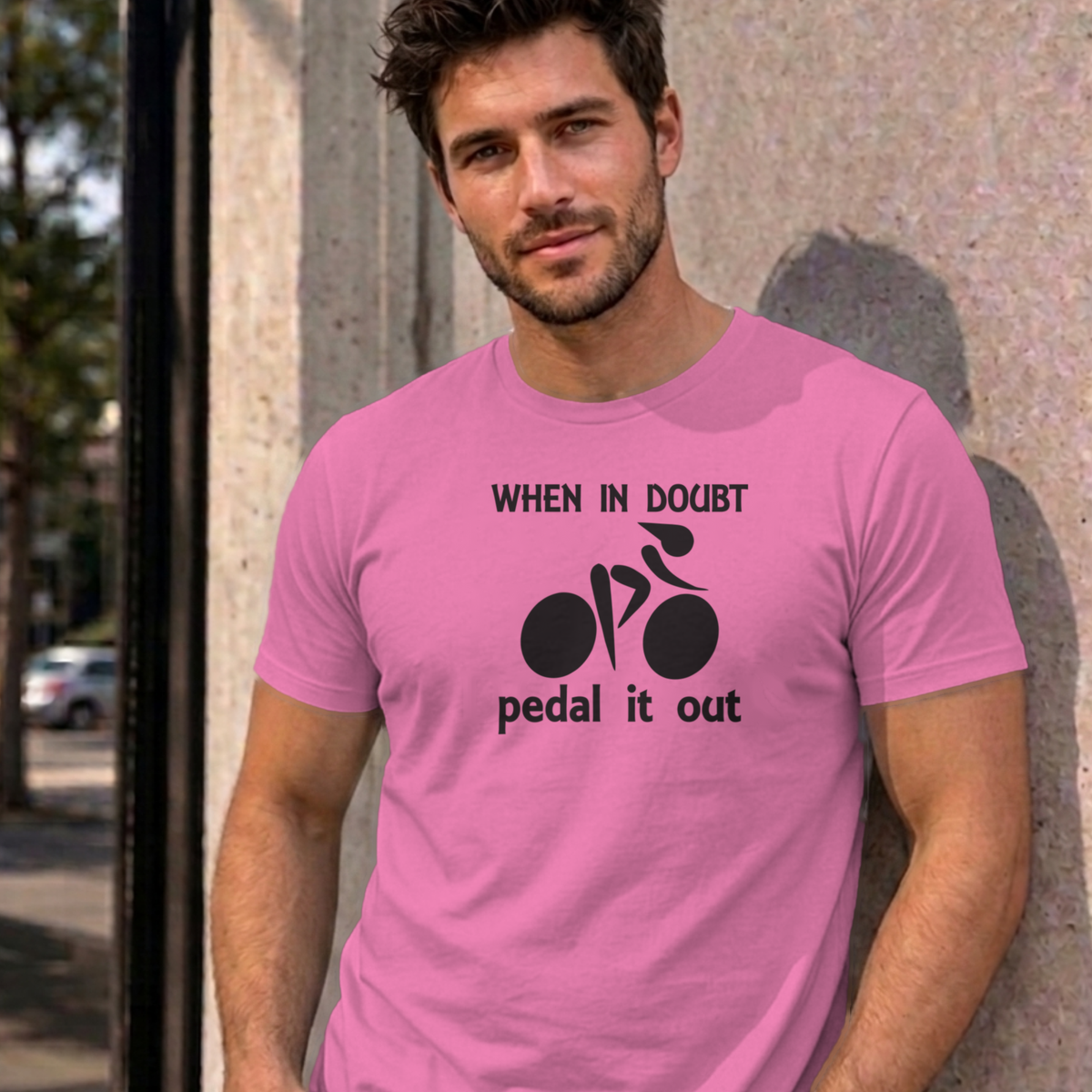 Man wearing the azalea Pedal It Out graphic tee