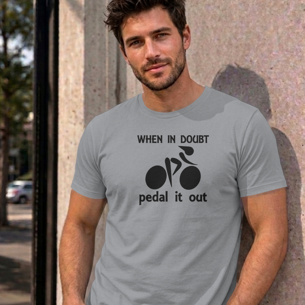 Man wearing the sport grey Pedal It Out graphic tee