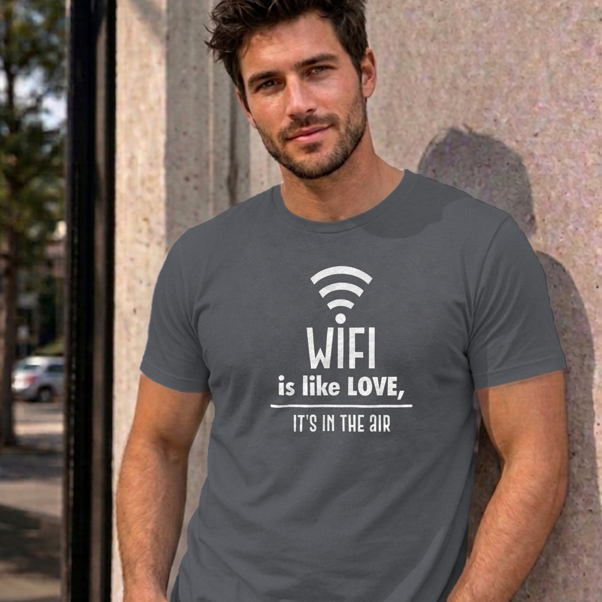 Man wearing the charcoal Wifi Is Like Love graphic tee