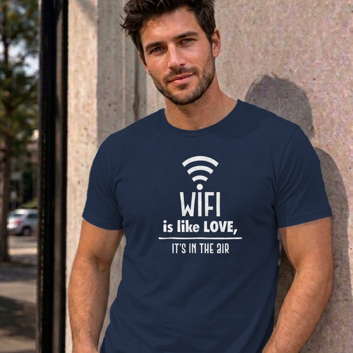 Man wearing the navy Wifi Is Like Love graphic tee