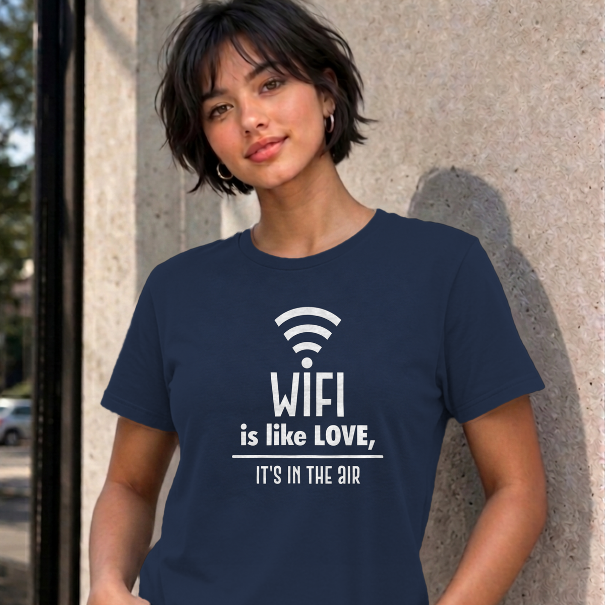 Woman wearing the navy Wifi Is Like Love graphic tee