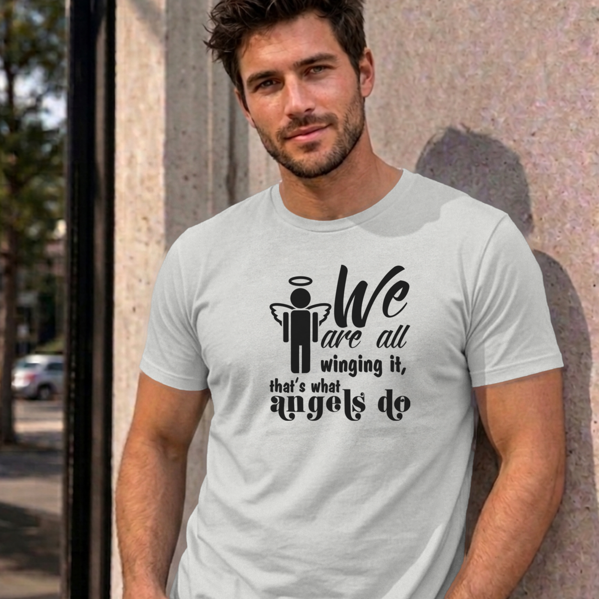 Man wearing the ash Winging It graphic tee