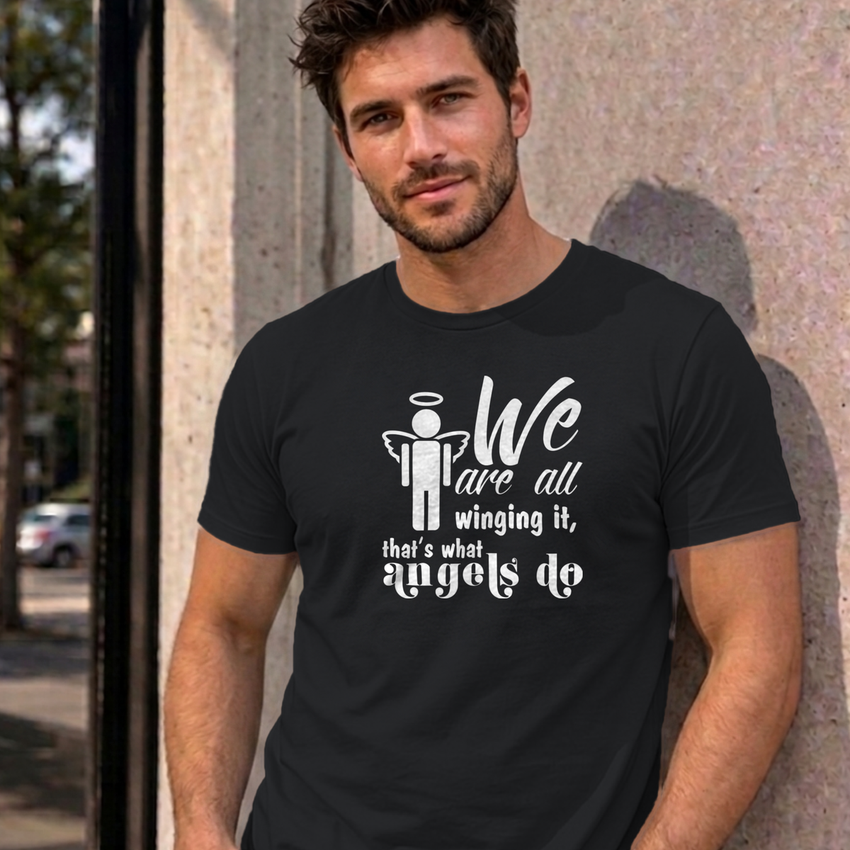 Man wearing the black Winging It graphic tee