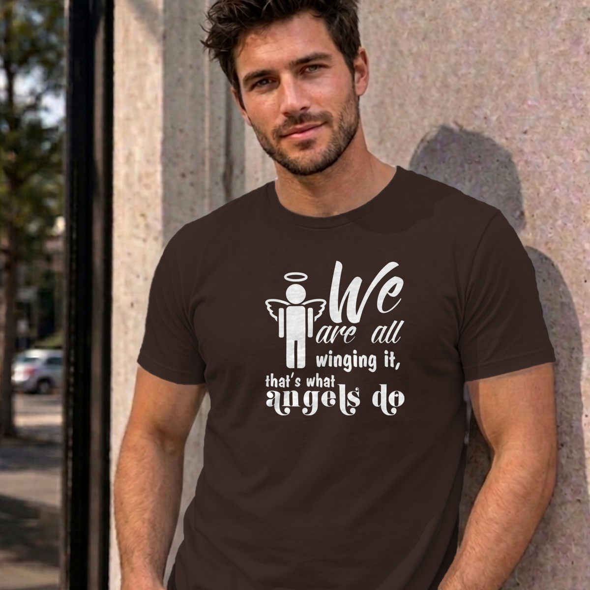Man wearing the dark chocolate Winging It graphic tee