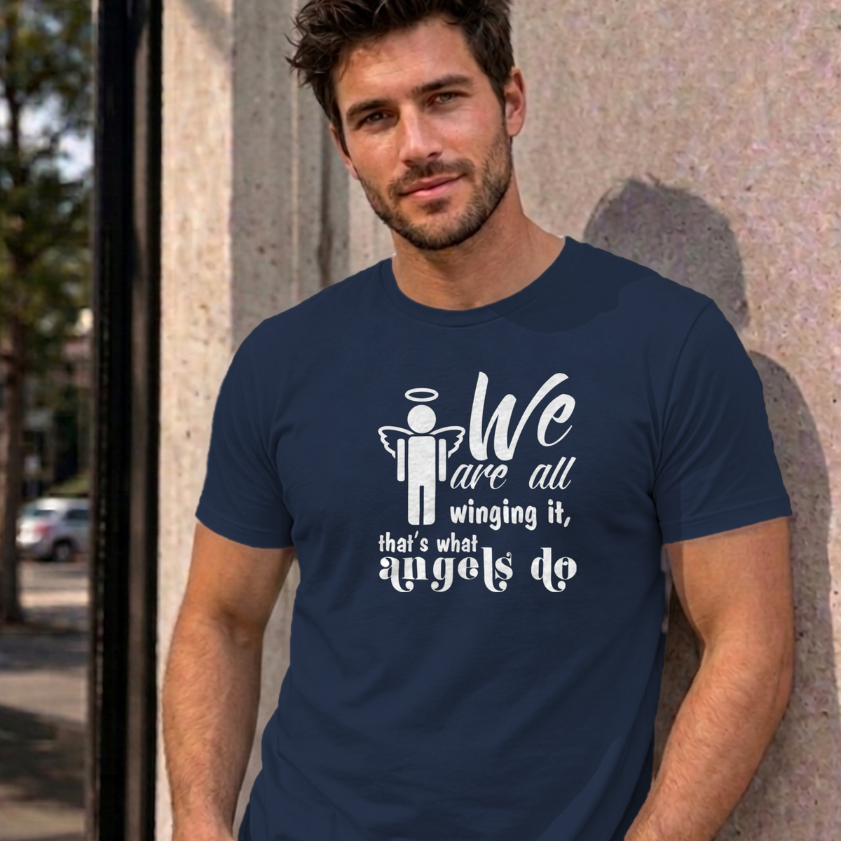 Man wearing the navy Winging It graphic tee