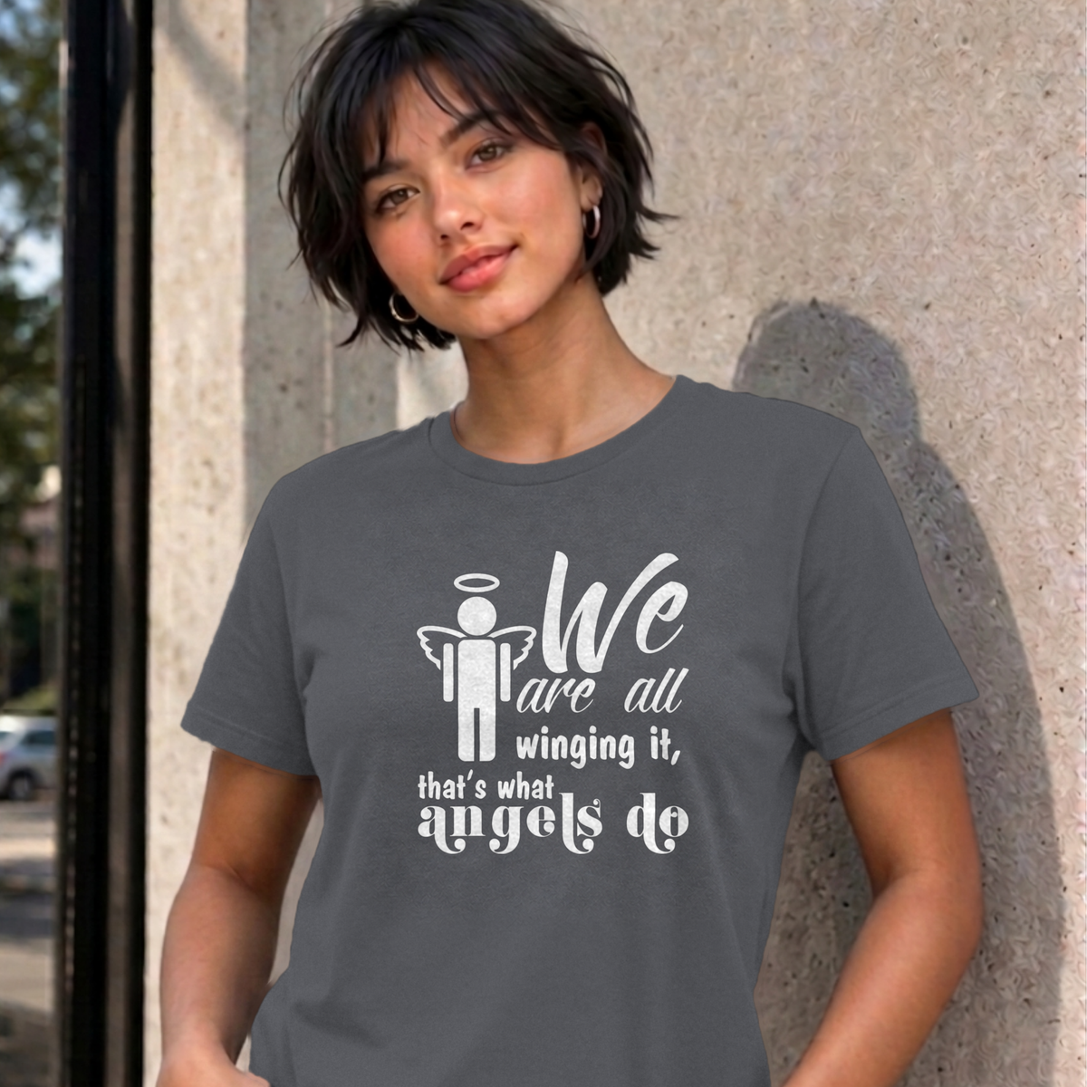 Woman wearing the charcoal Winging It graphic tee