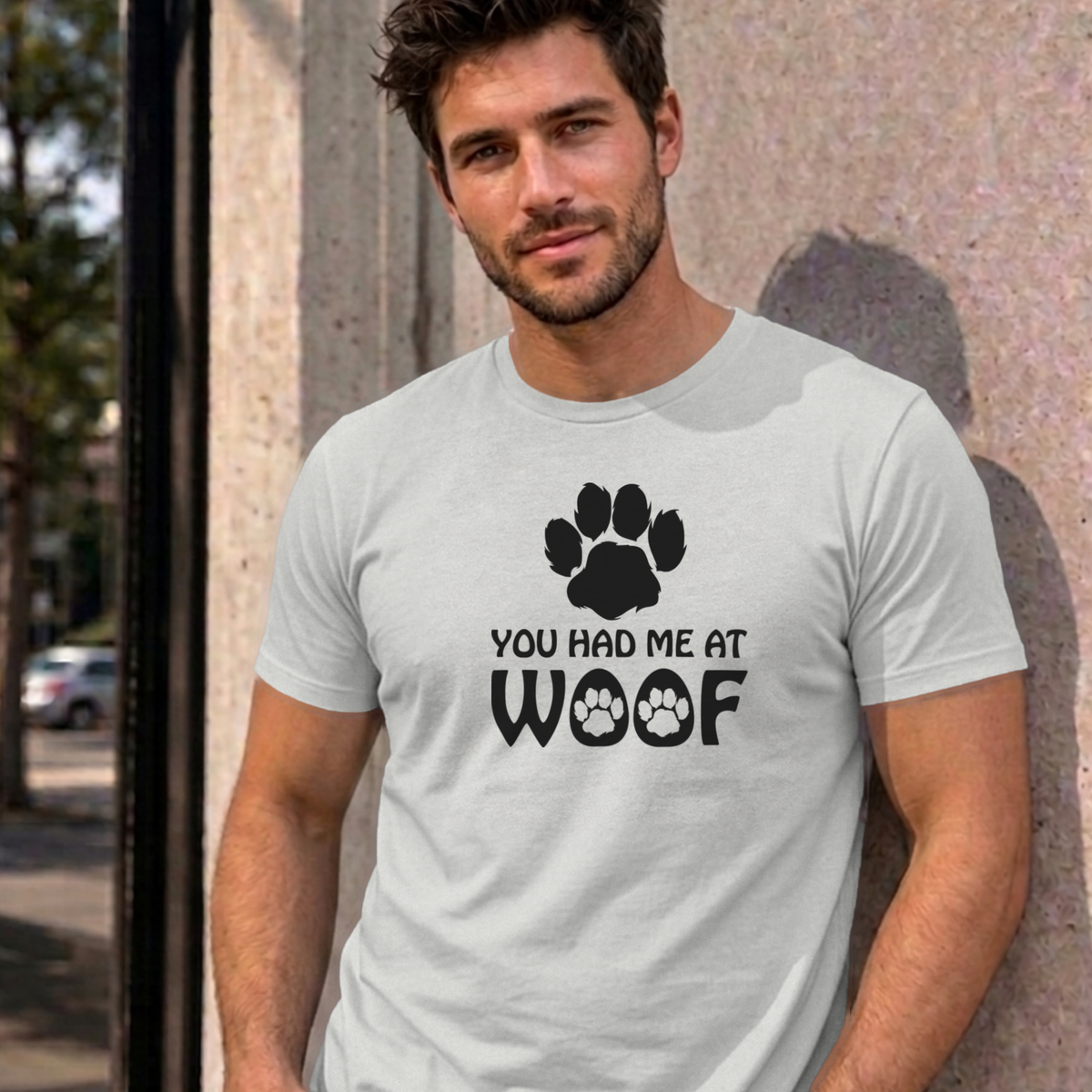 Man wearing the ash You Had Me at Woof dog graphic tee