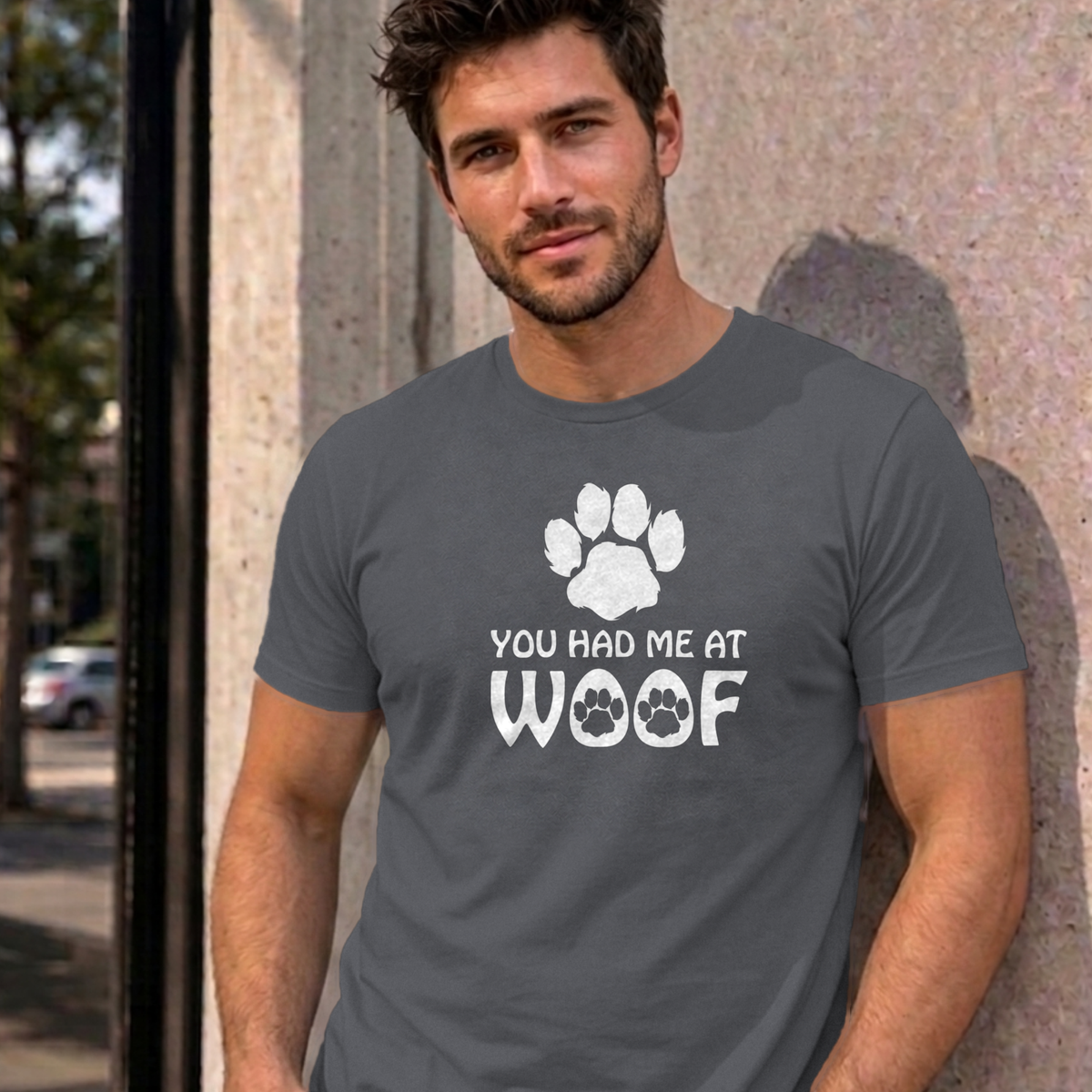 Man wearing the charcoal You Had Me at Woof dog graphic tee