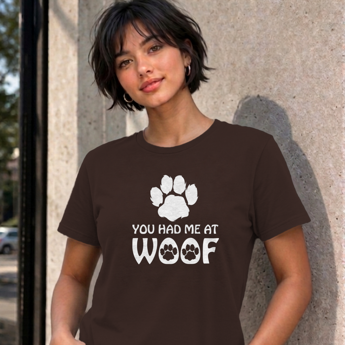 Woman wearing the dark chocolate You Had Me at Woof dog graphic tee