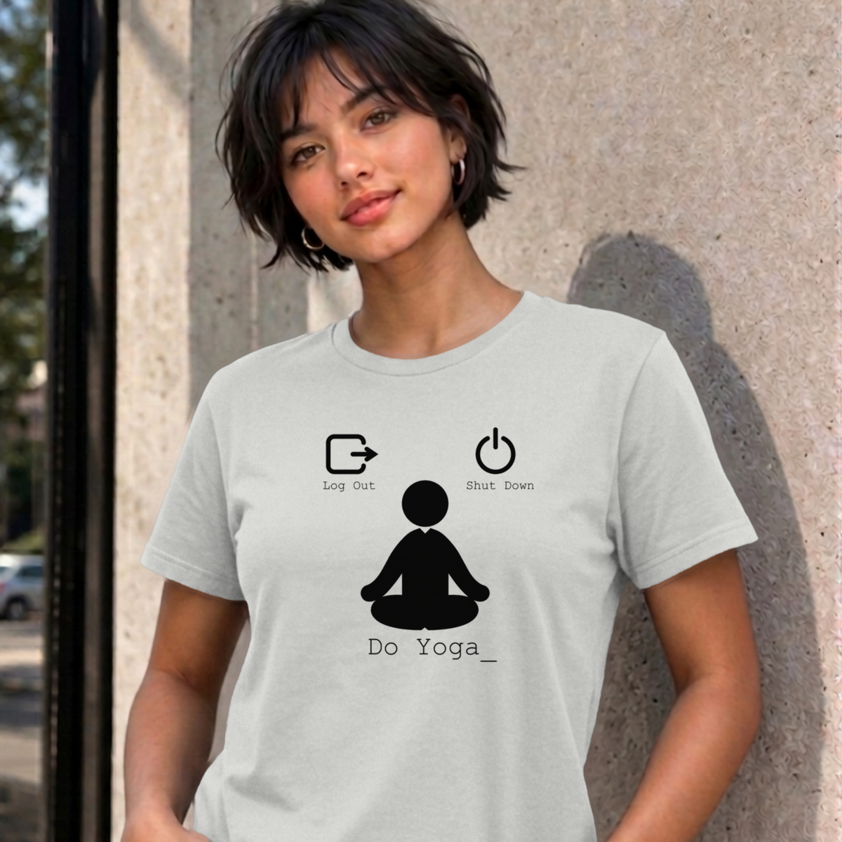 Woman wearing the ash Log Out Shut Down Do Yoga graphic tee