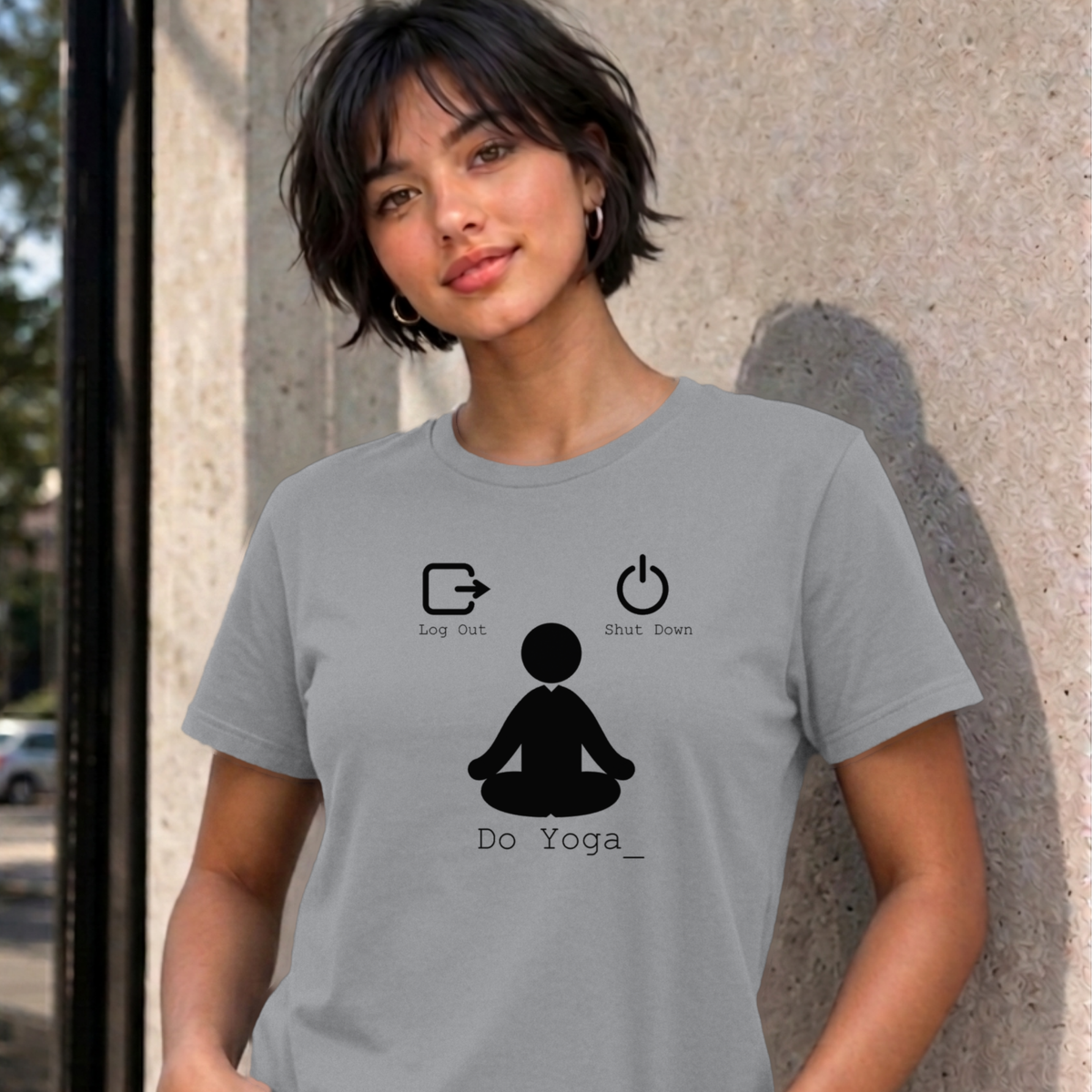 Woman wearing the sport grey Log Out Shut Down Do Yoga graphic tee