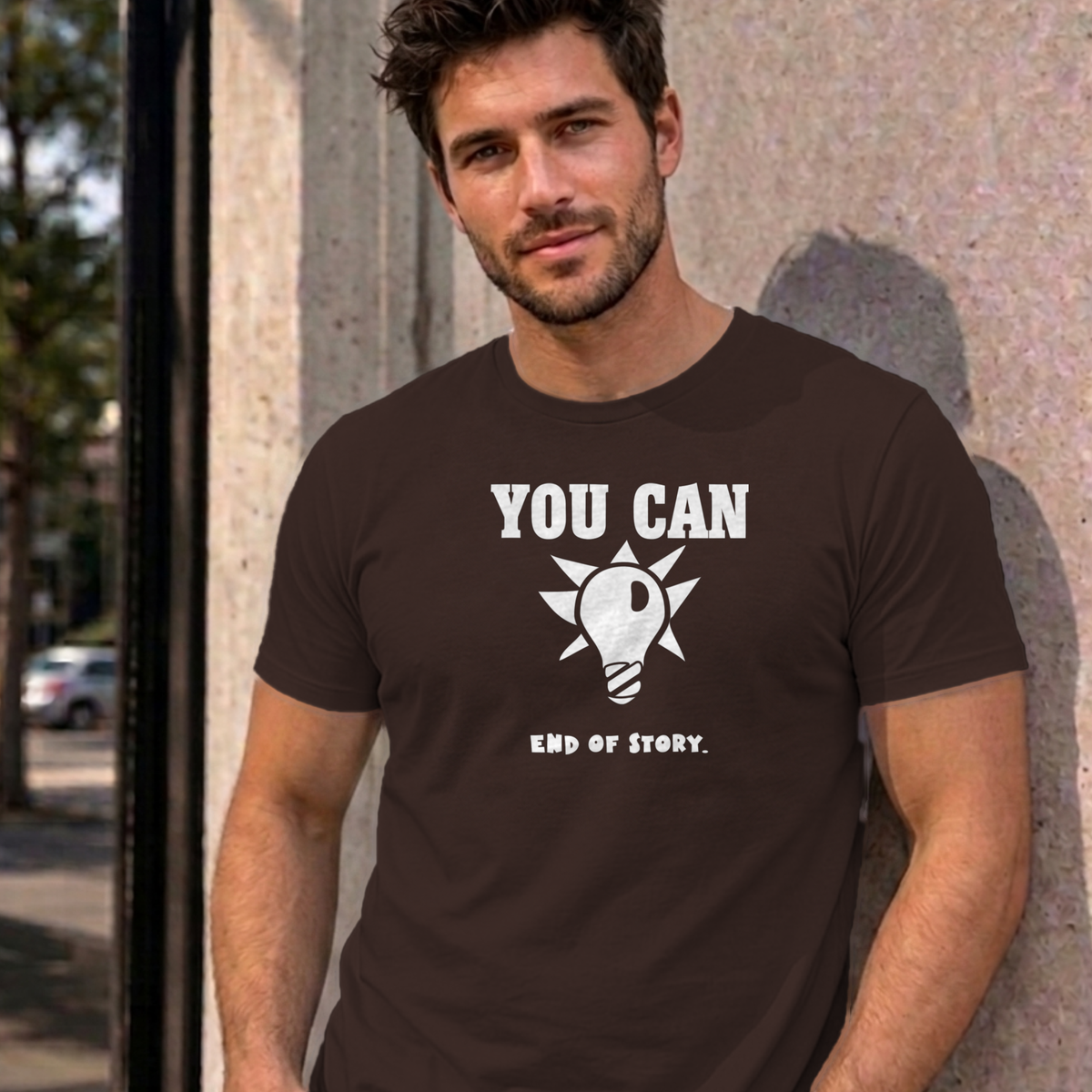Man wearing the dark chocolate You Can Light Bulb graphic tee